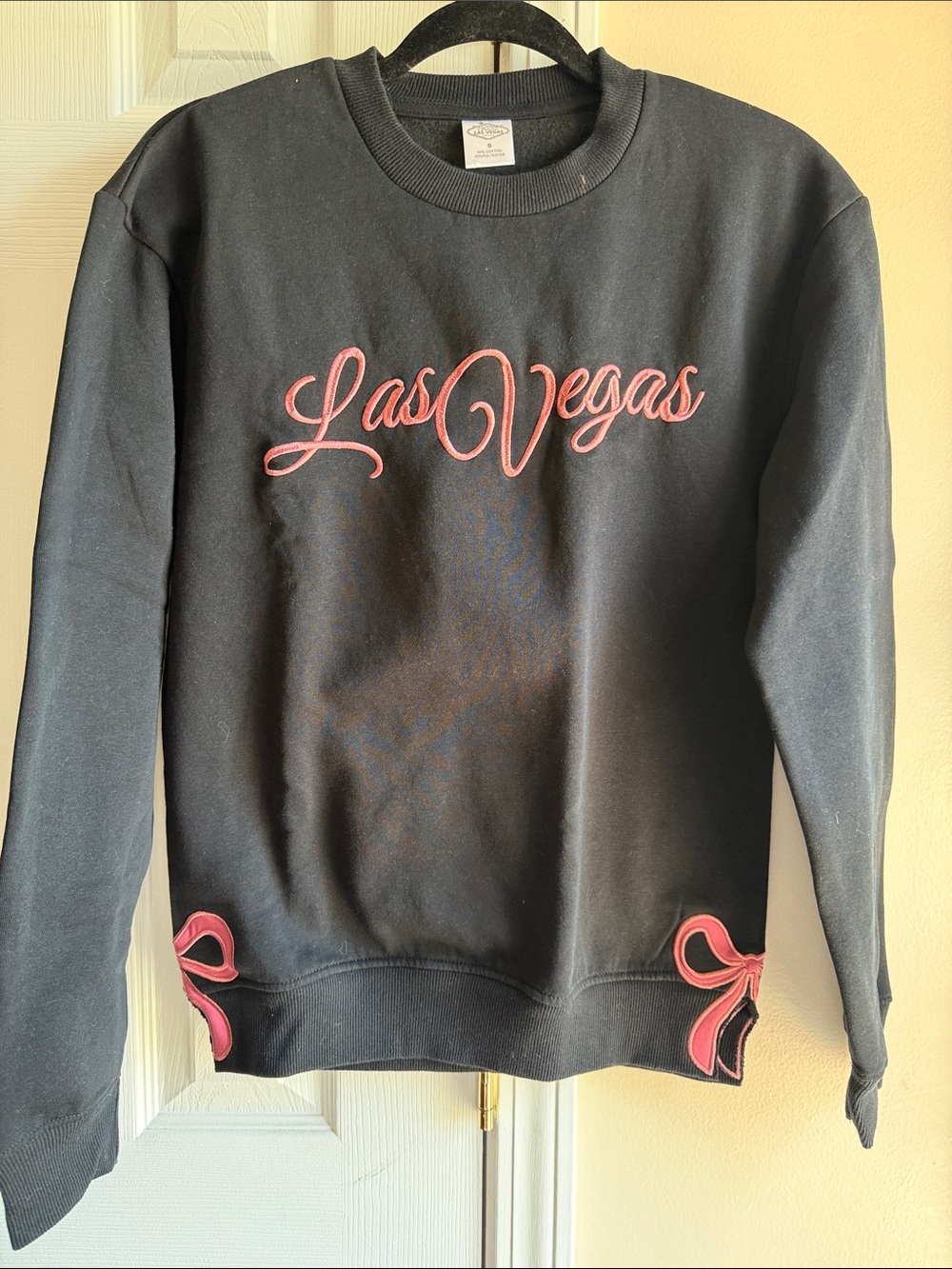 Black Crewneck Sweatshirt with Pink Las Vegas Script and Bow Accents